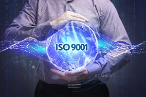 illustration - man holding technology with label ISO 9001