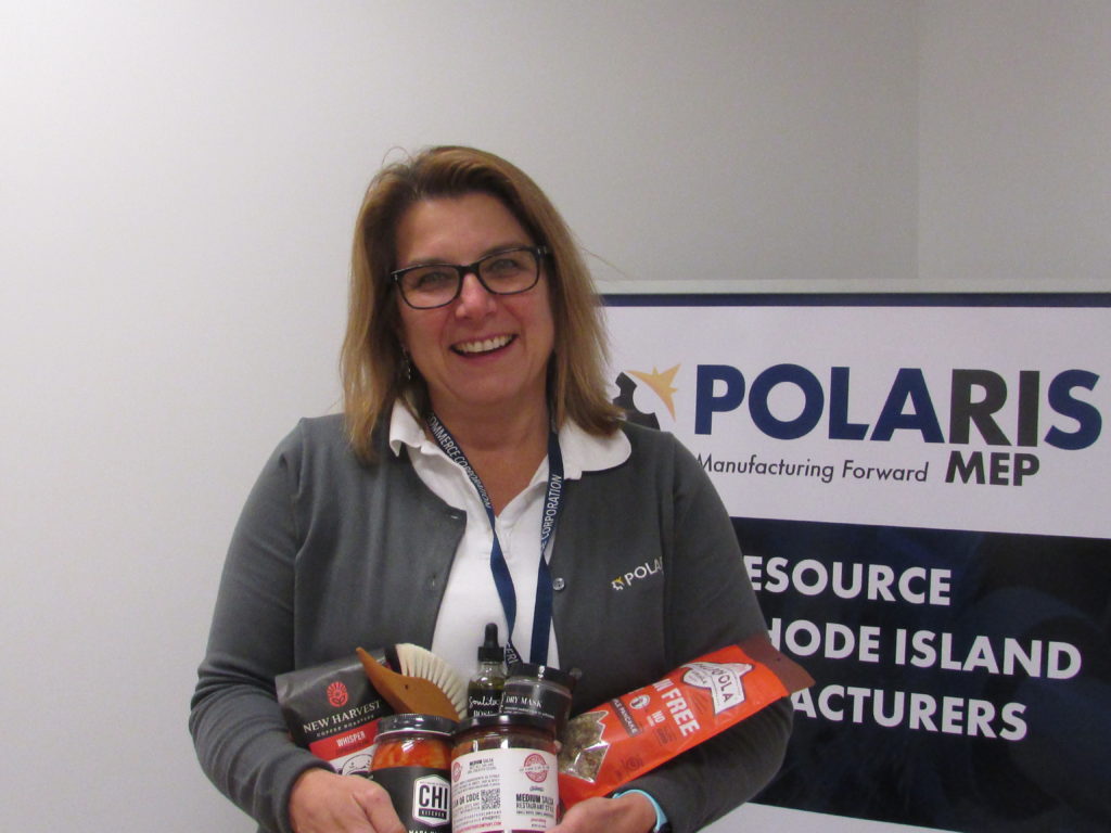 Polaris MEP Center Director holds Made In RI manufactured products