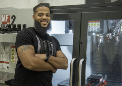 Adonis Summerville, senior CNC instructor for JARC, explained the skills needed to run highly advanced machines such as those at the new JARC Rhode Island location.